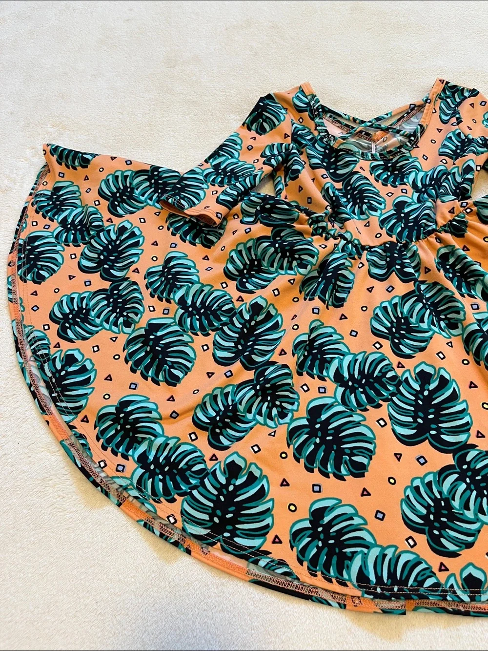 Dot Dot Smile | Little Girls Peach Monstera Leaf Dress 3/4